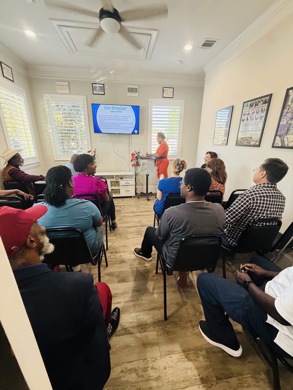 Attendees seated in rows facing a presentation screen during a Catalysts training session